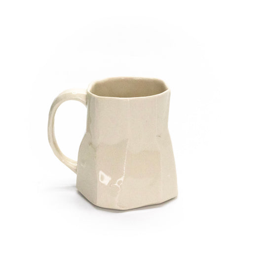 Small white facet mug by Frank Fabens